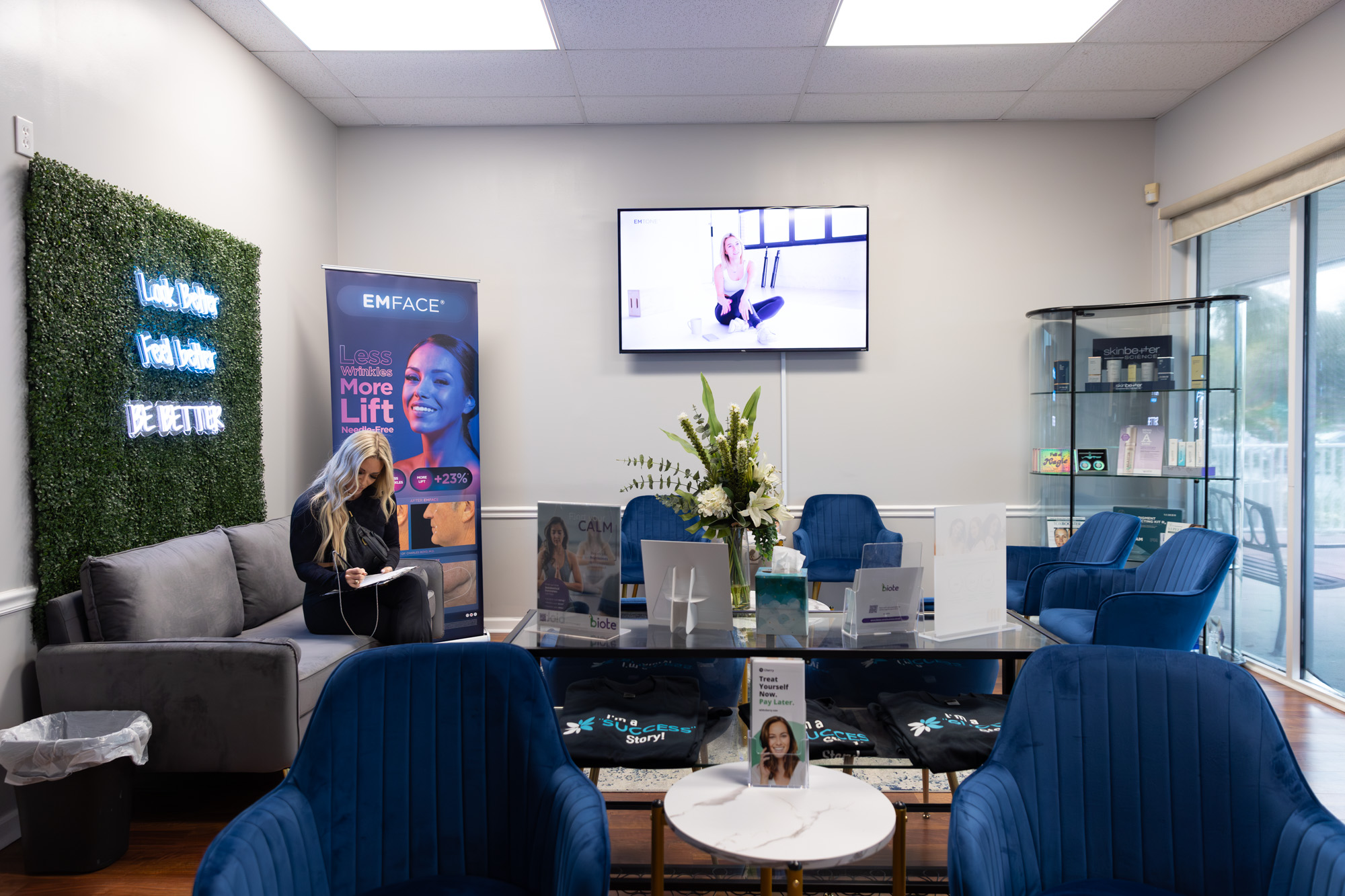 A female patient fills out paperwork in a lobby to receive HRT in St. Petersburg