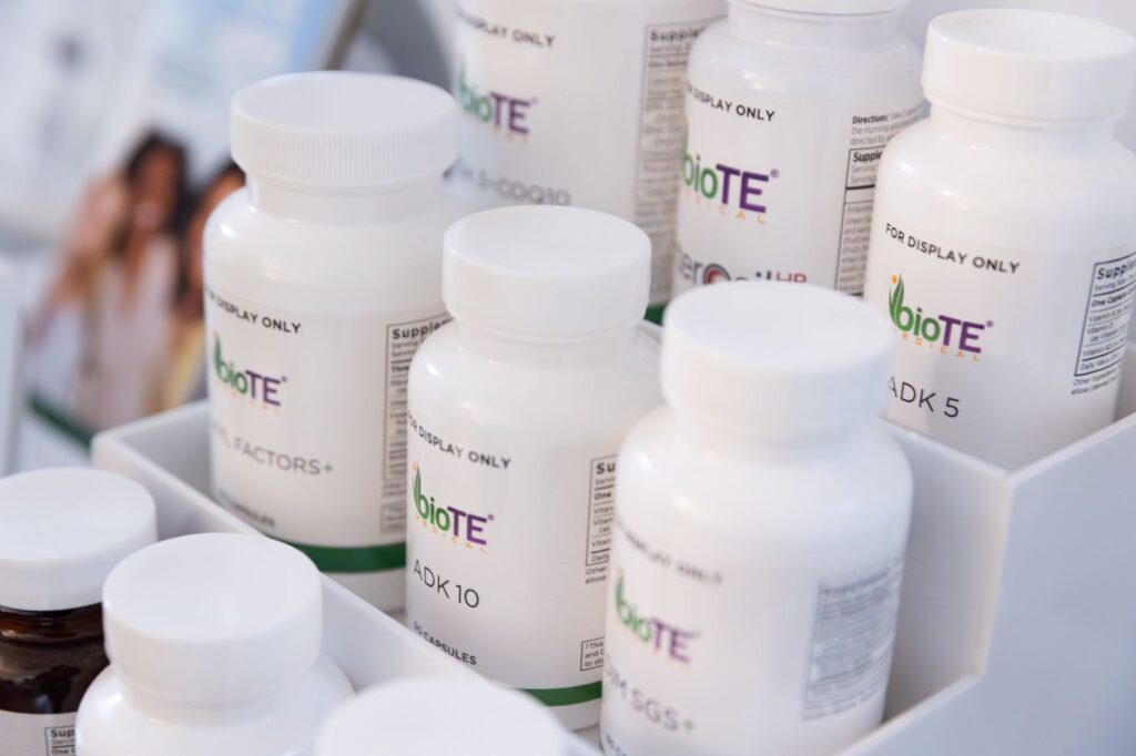 A selection of white pill bottles lined up for bioidentical hormone replacement therapy in St. Petersburg